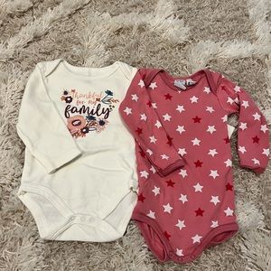 2 long sleeved girls onesies.